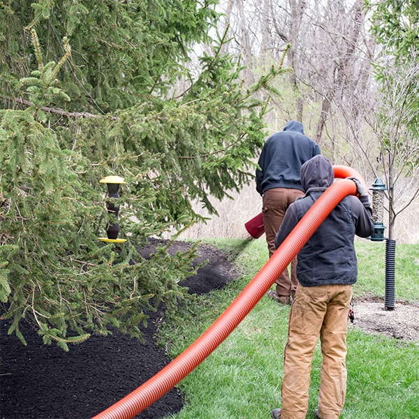 mulch blowing requires specialized equipment, including a truck-mounted blower and hose system for efficient application